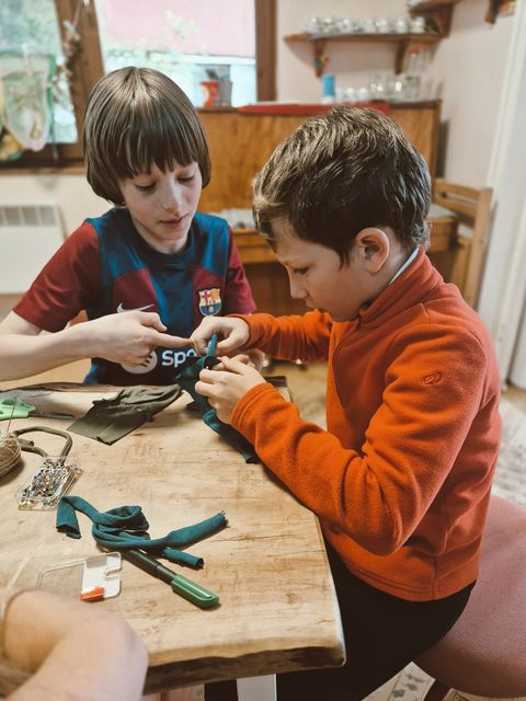 Close-up of small hands at careful work